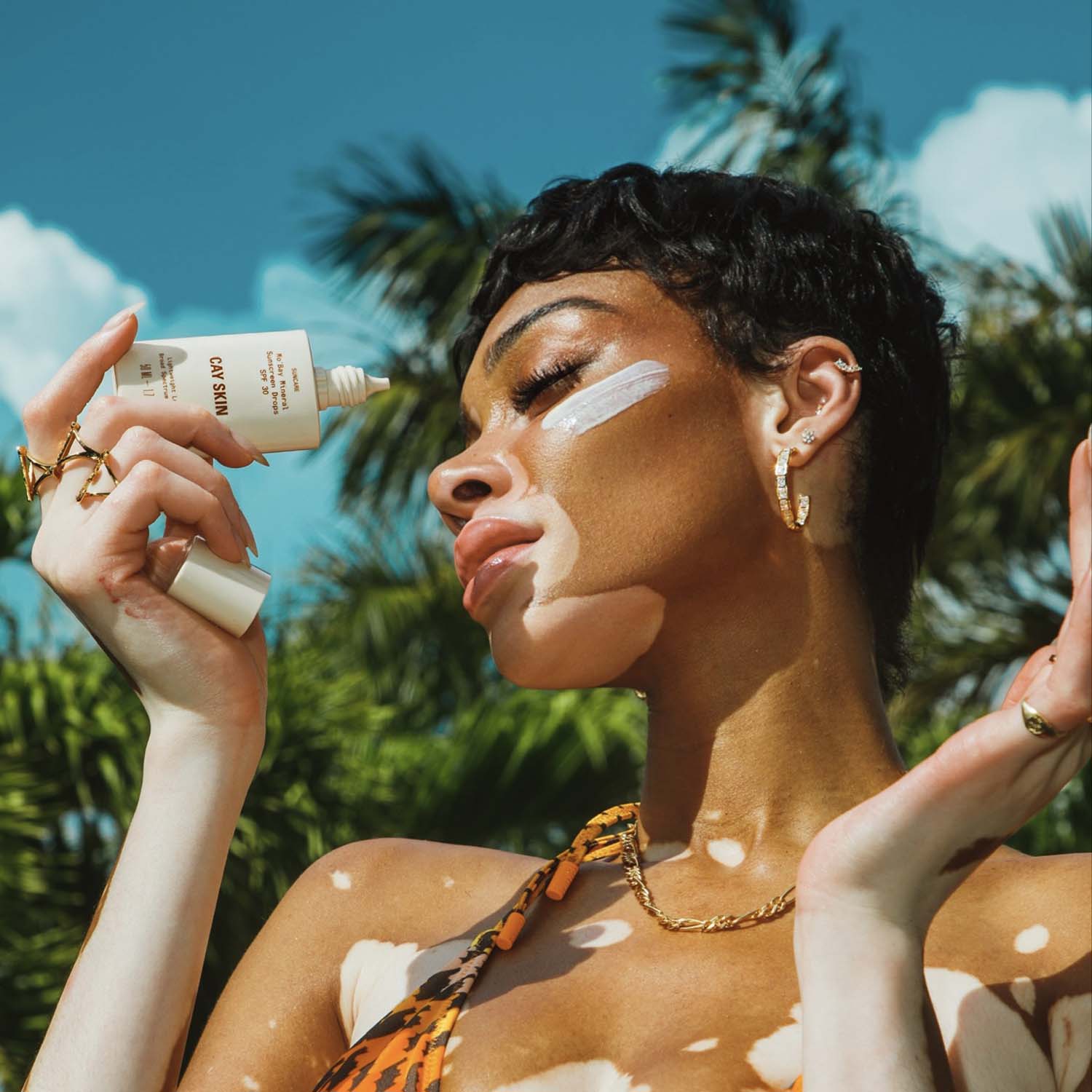 Winnie Harlow with Cay Skin Mo’Bay Mineral Sheer-Melt Sunscreen Drops SPF 30