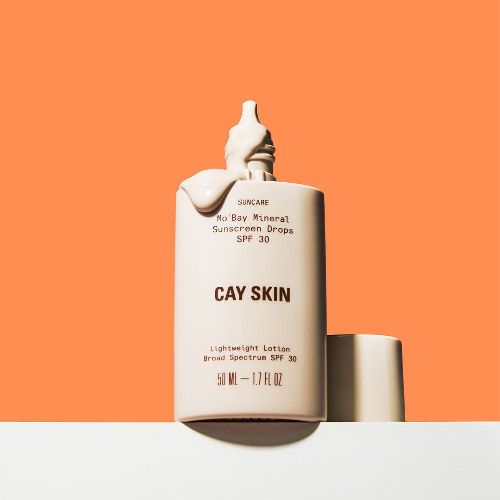 Open bottle of Cay Skin Mo’Bay Mineral Sheer-Melt Sunscreen Drops SPF 30